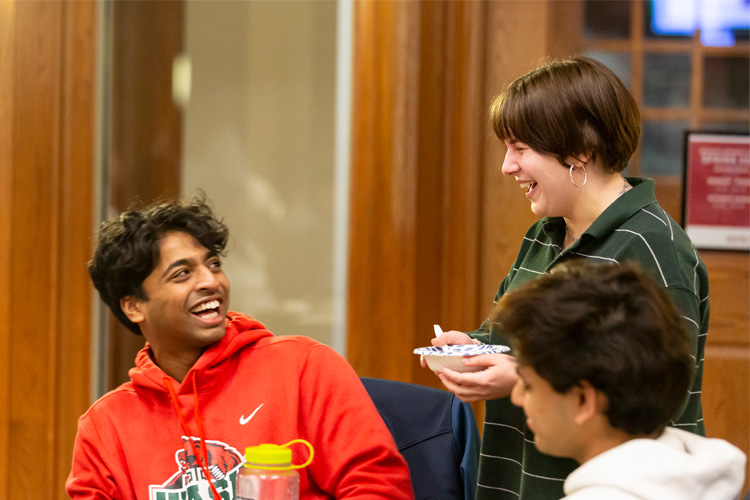 students laughing at dinner